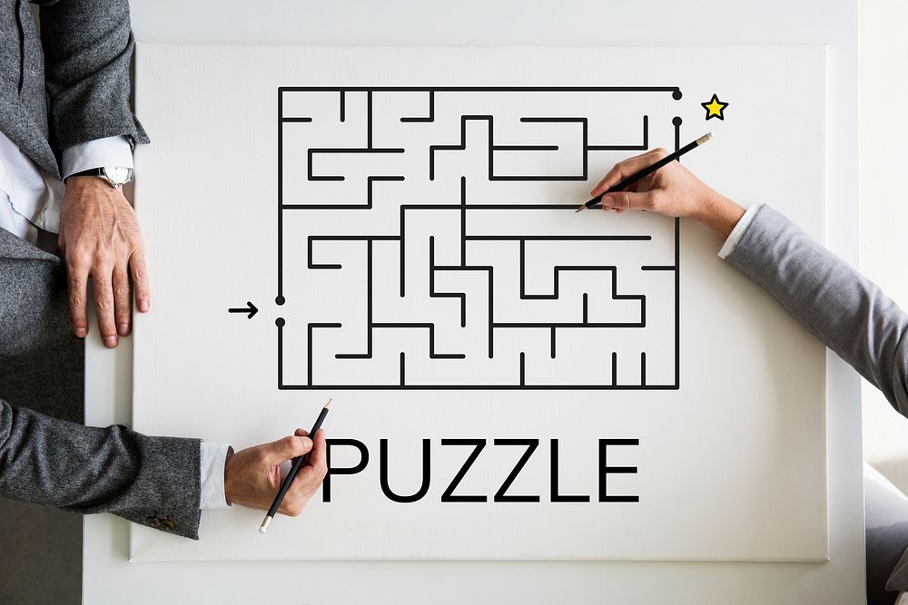 Businessmen solving maze puzzle together