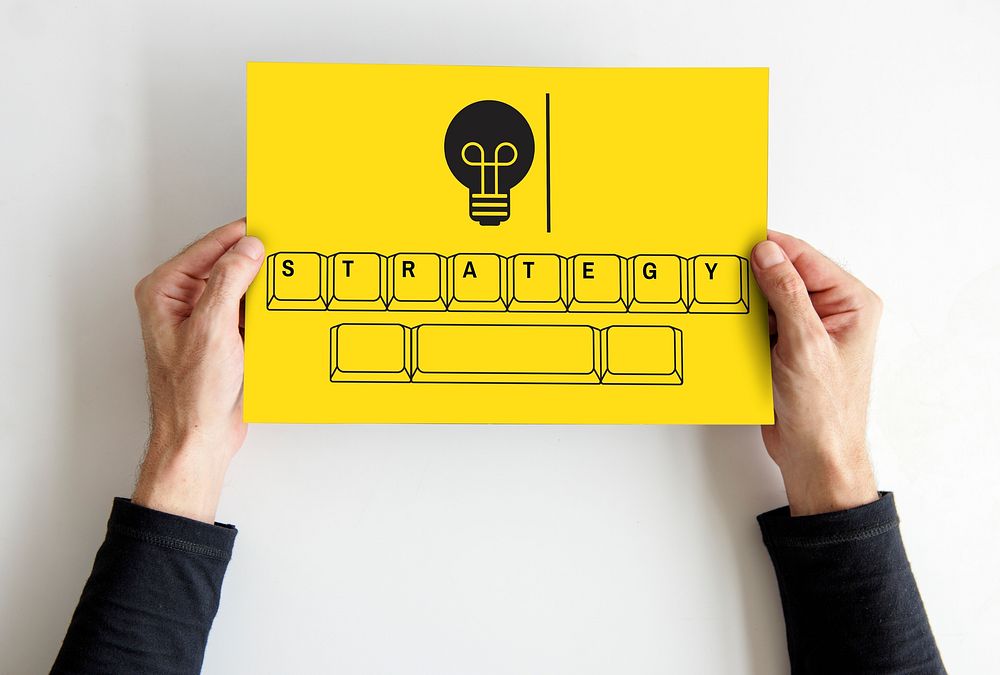Strategy on keyboard with light bulb icon