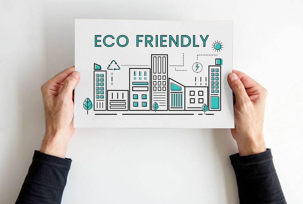 Hands holding paper building eco city graphic