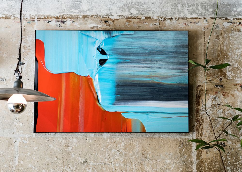 Framed abstract painting hanging on a wall