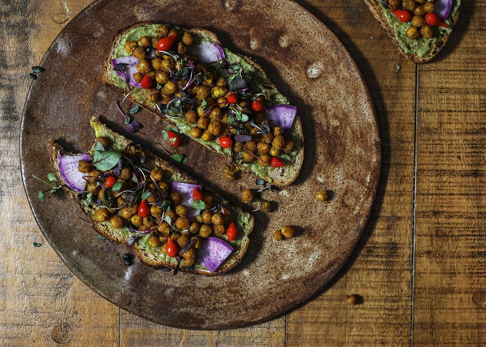 Homemade organic chickpea toast on a wooden plate