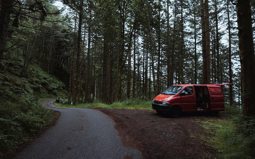 Red van parked in Mull temperate rainforest