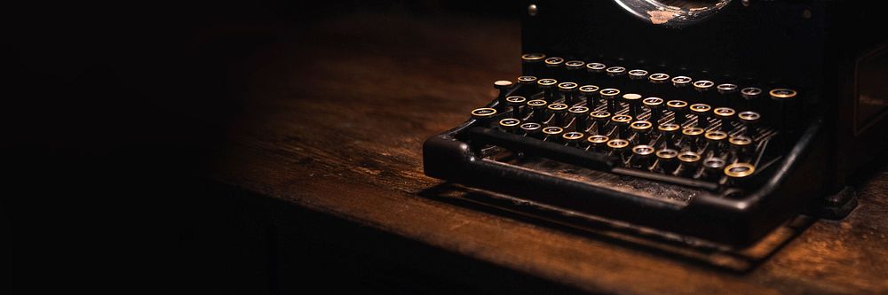 Old typewriter on a wooden table