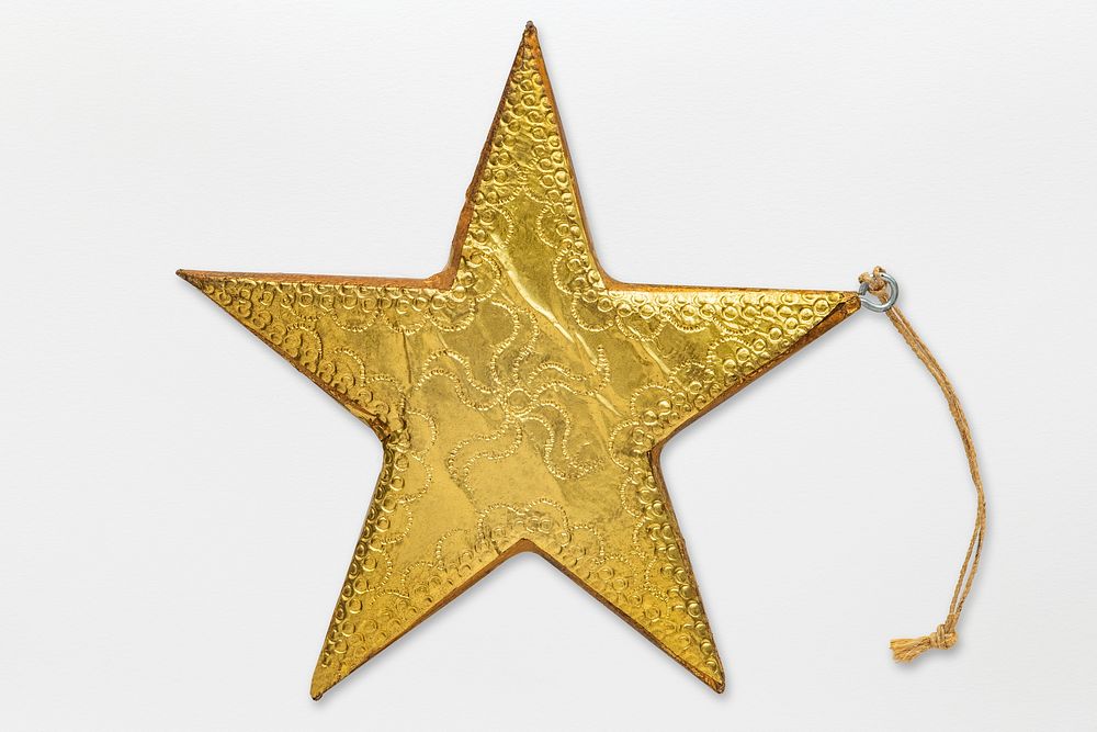 A gold star Christmas ornament isolated on gray background