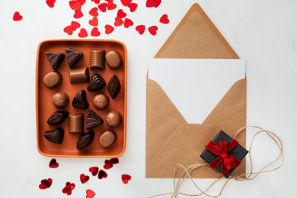 Valentines day card by a tray of chocolates