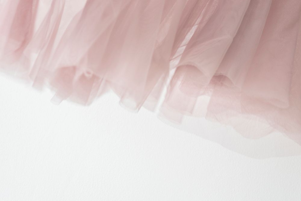 Pink chiffon fabric texture on white background