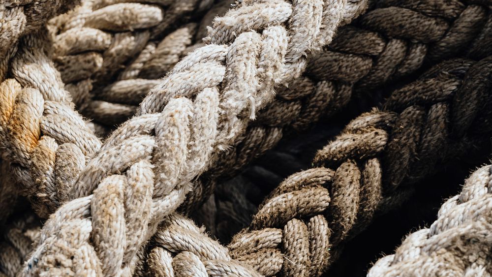 Old weathered harbor ropes textured background