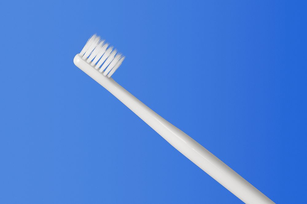 Gray toothbrush on a blue background