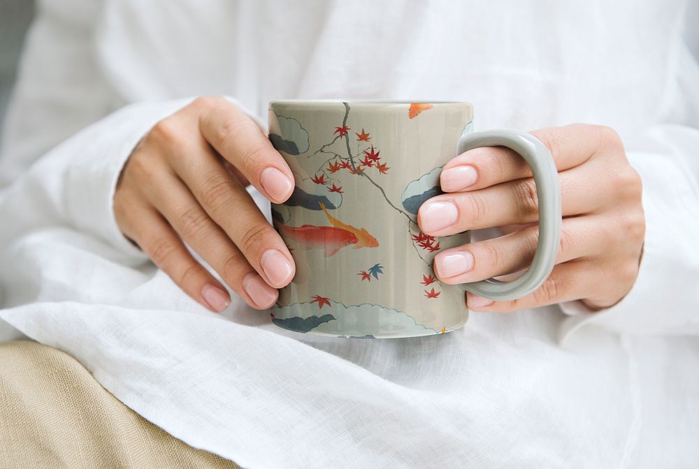 Woman holding a Japanese pattern coffee mug, remix of artwork by Watanabe Seitei