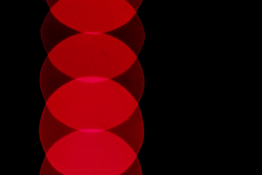 Red blurred lights on a black background