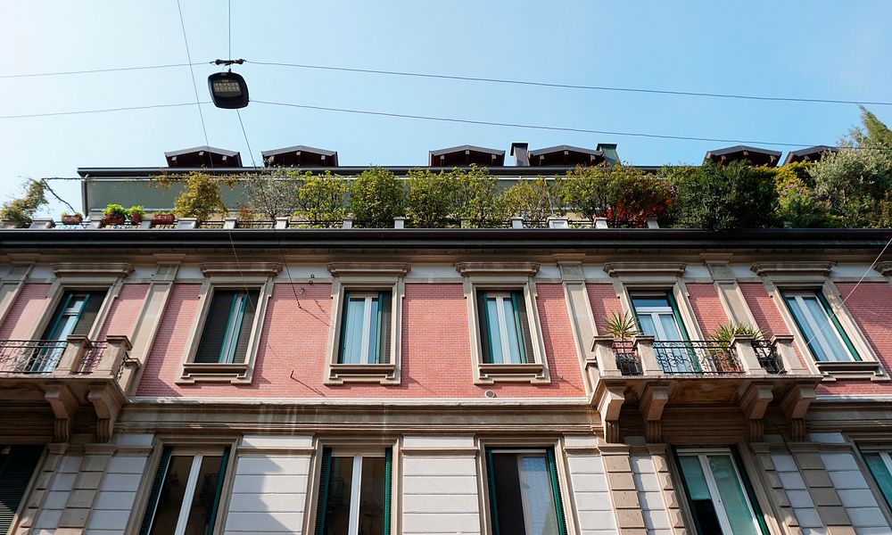 Residential building with flowerpots in Italy