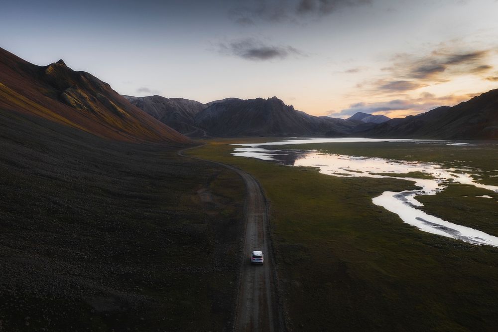 2019, Iceland, White Landrover driving on a dusty sand road