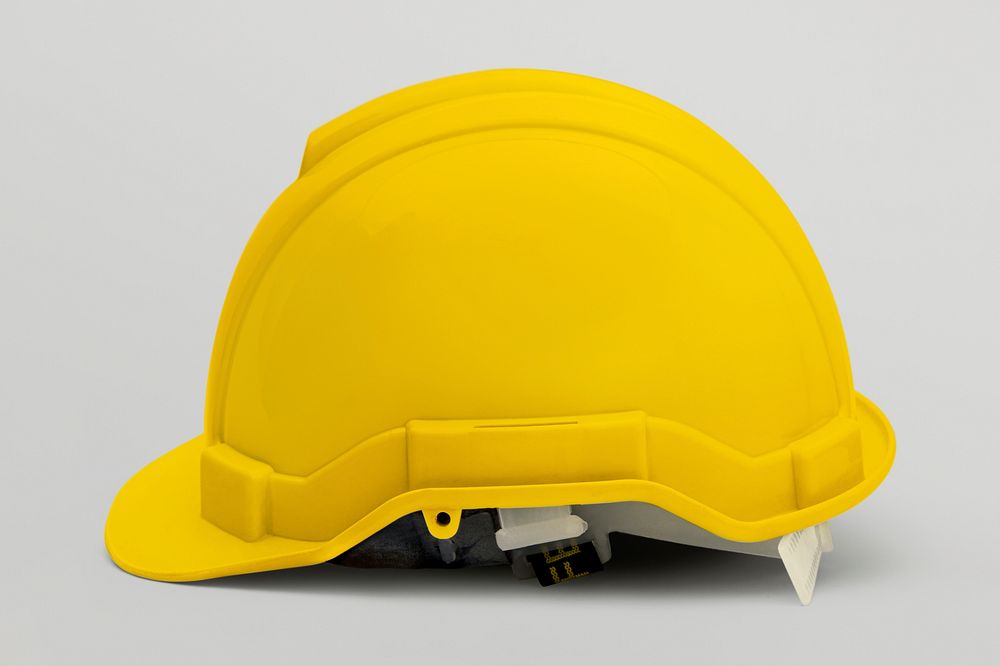 Yellow hard hat on a gray background