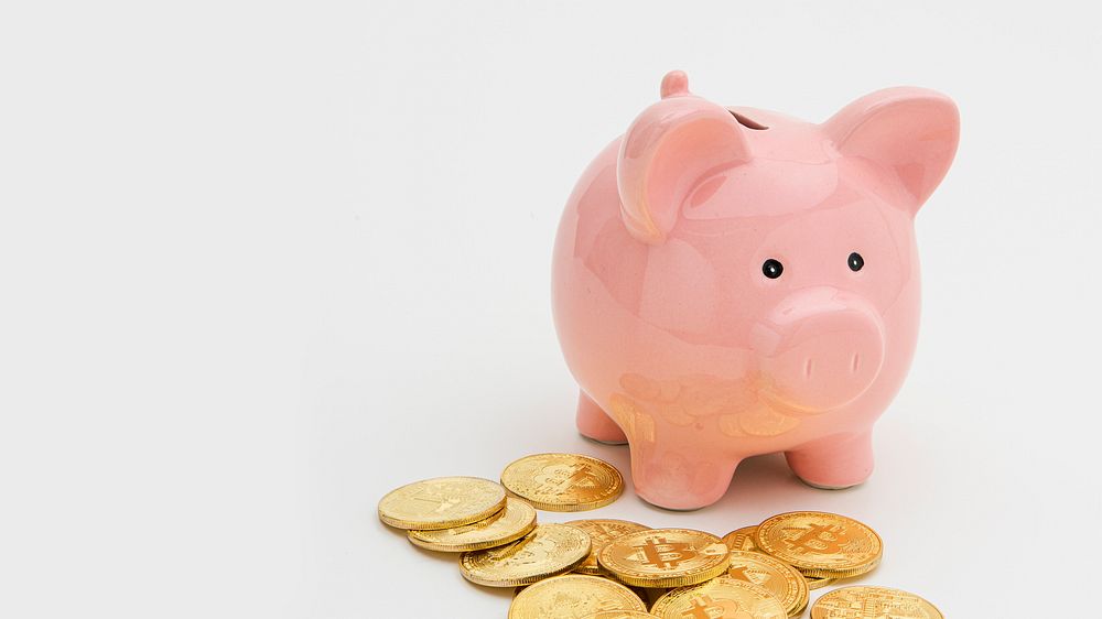 Pink piggy bank with bitcoins design resource