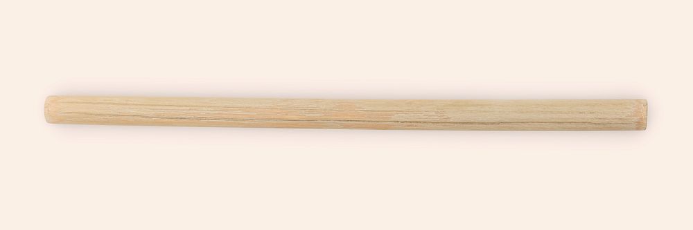 Reusable bamboo wood straw on cream background