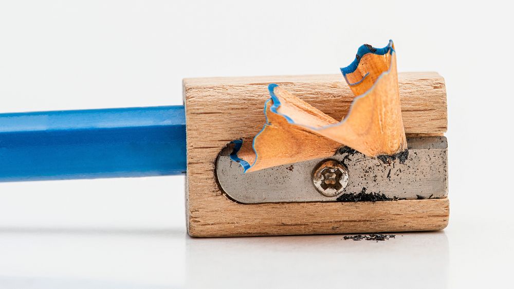 Wooden pencil sharpener with blue pencil