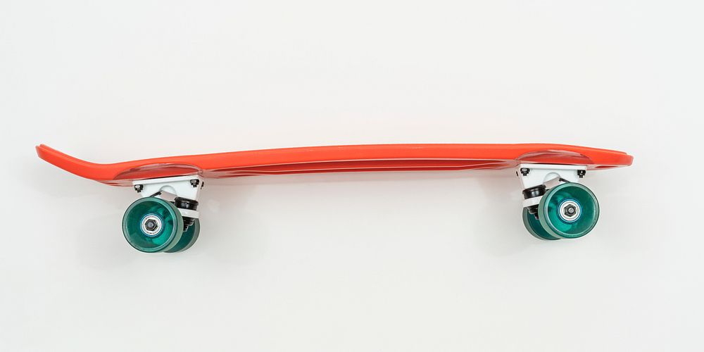 Red skateboard on white background