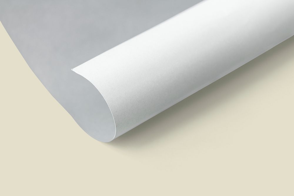 Gray and white rolled paper mockup on a beige background