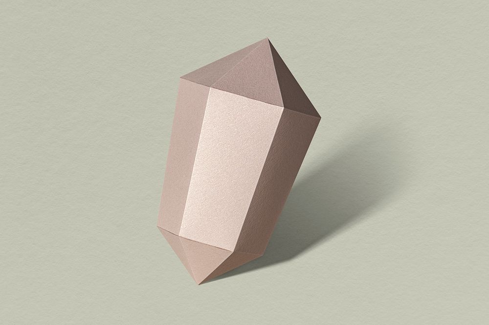 Pink hexagonal prism paper craft on a sage green background