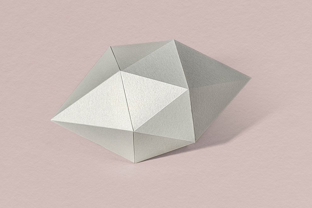 3D silver octahedral polyhedron shaped paper craft on a dull pink background 