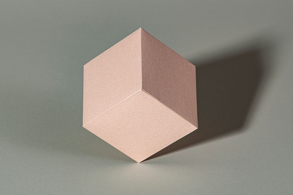 3D pink cubic paper craft on a gray background