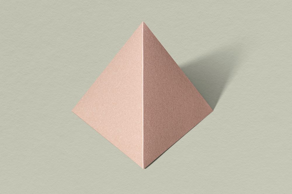 3D pink pyramid paper craft on a sage green background