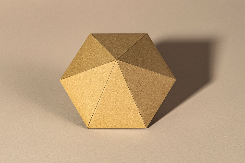 3D golden diamond shaped paper craft on a beige background