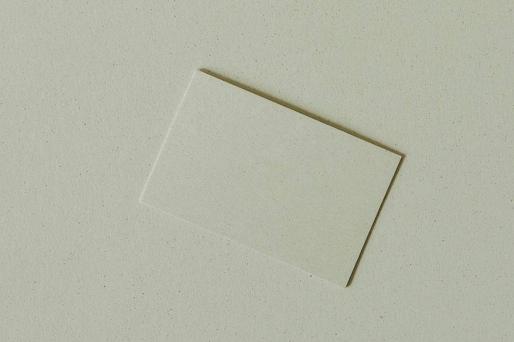 Blank green business card on green background