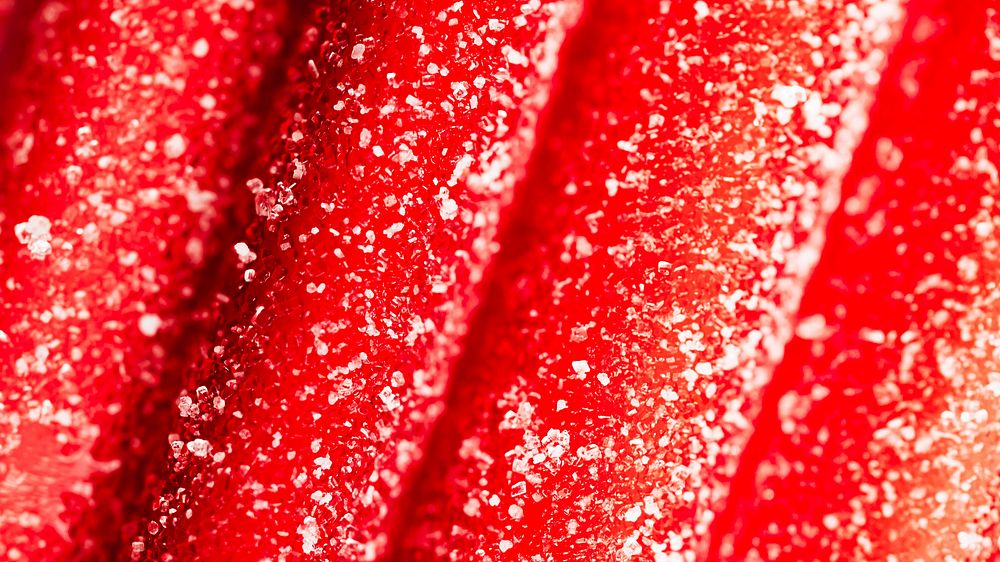 Red chewy candies coated with sugar 