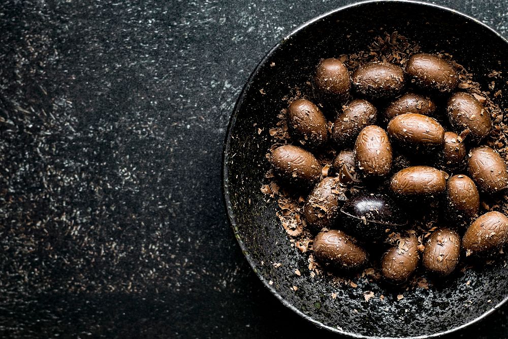 Brown homemade Easter chocolate eggs in a bowl