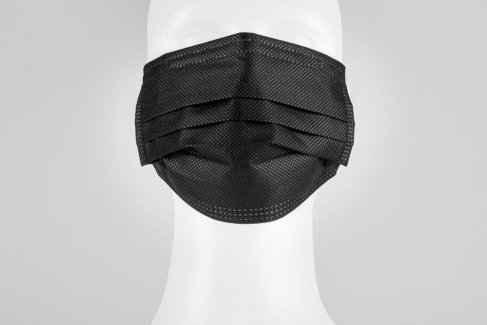 Black disposable medical face mask on a mannequin