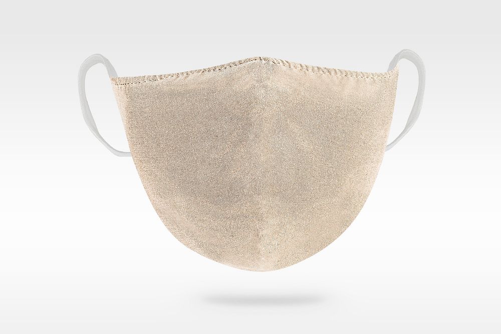 Beige protective cloth mask on white background