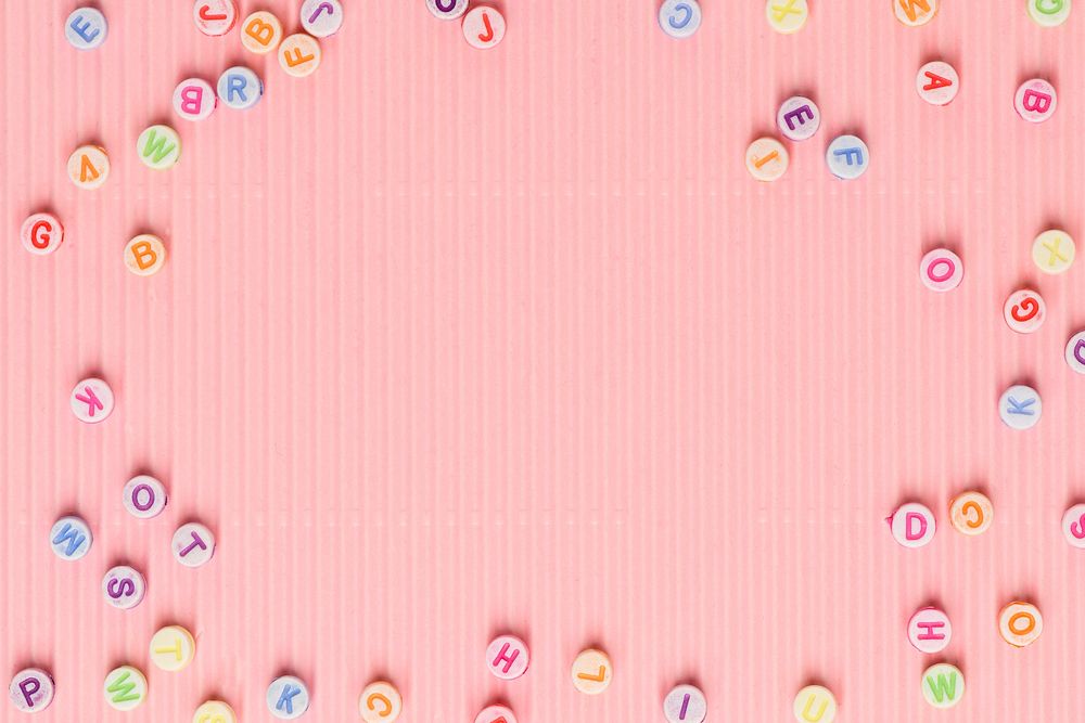 Letter beads border pink wallpaper background