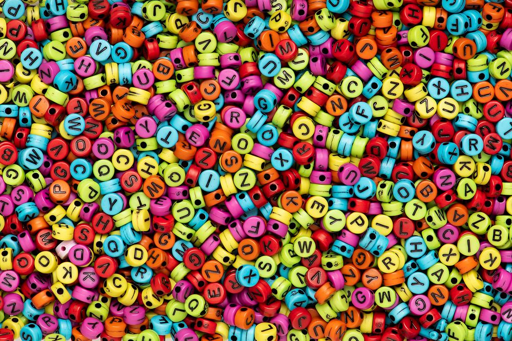 Colorful English letter beads background