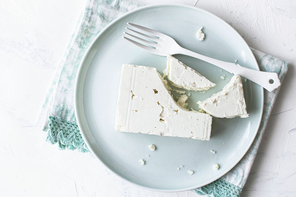 Natural feta cheese on a plate flat lay
