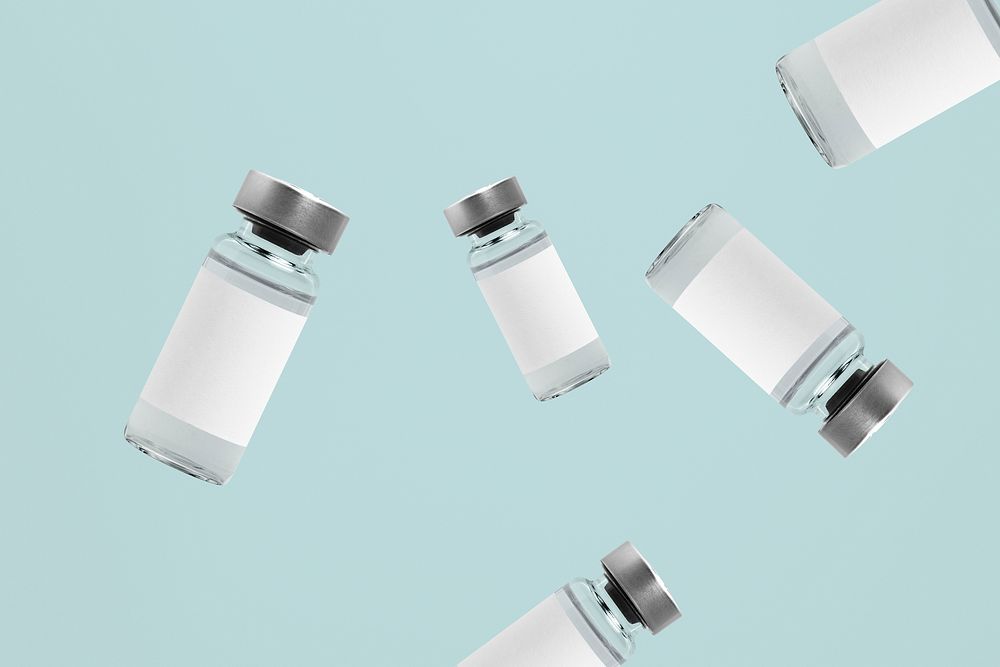 Falling injection vial glass bottles with white labels