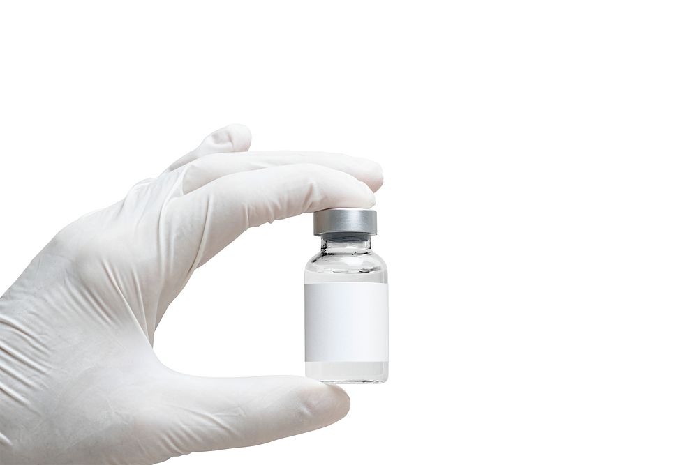 Medicine vial with label mockup psd in nurse's hand
