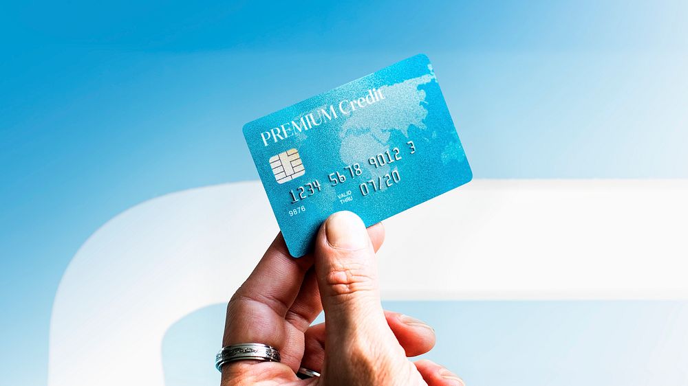 Woman holding a premium credit card