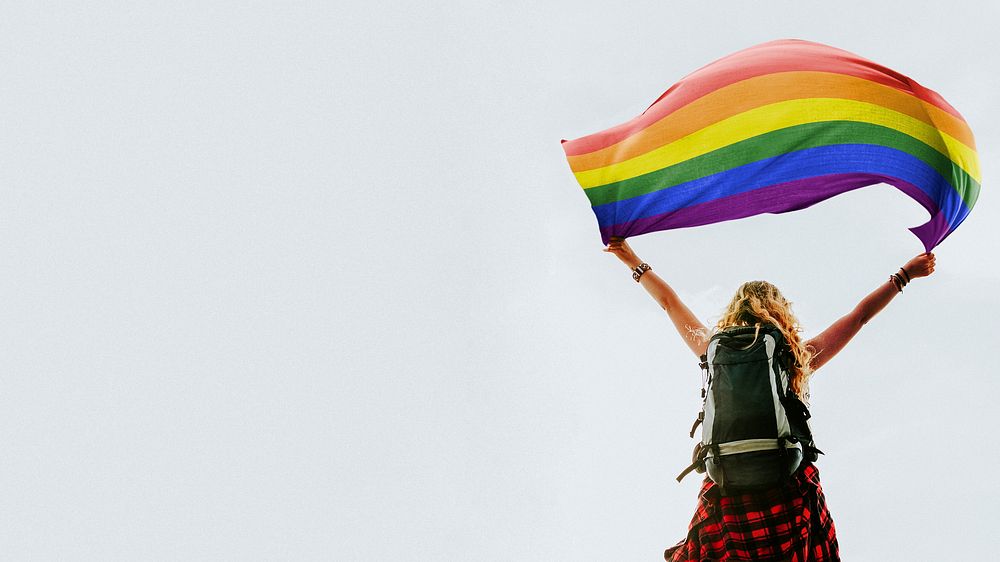 Woman holding the Pride flag