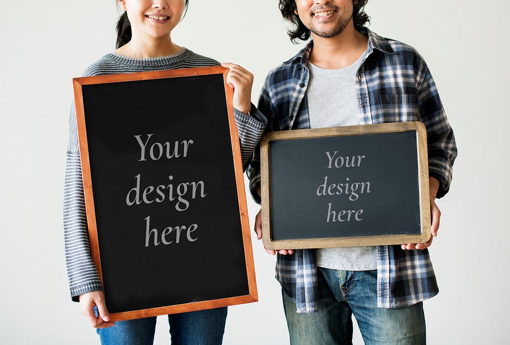Asian couple standing with blackboard mockups