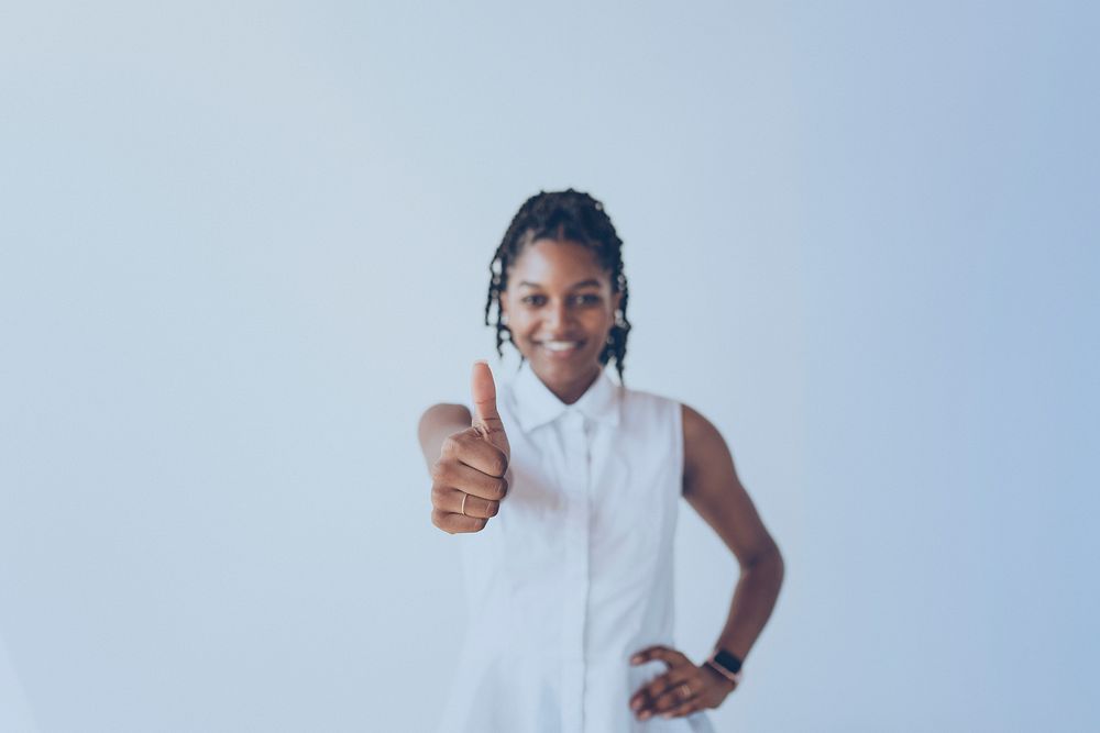 Black woman showing a thumbs up