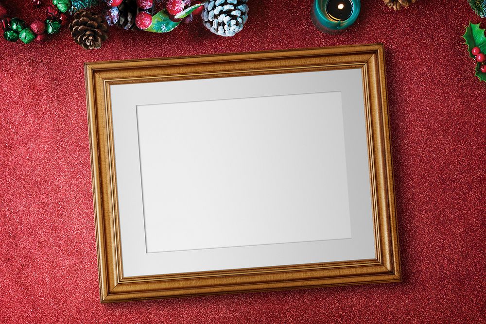 Classic gold frame mockup with Christmas decorations on red background