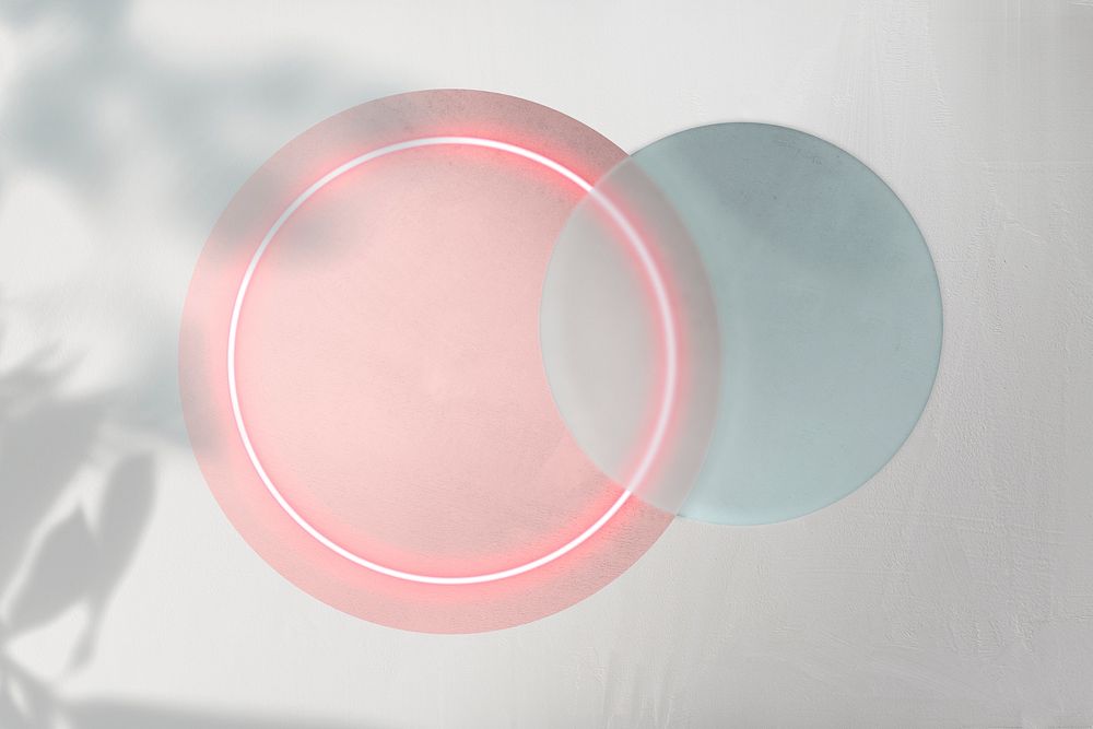 Pink neon light in a round shape with leaf silhouette