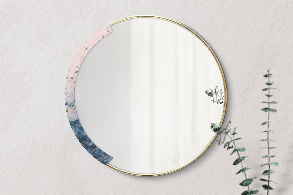 Marble framed mirror on a beige wall