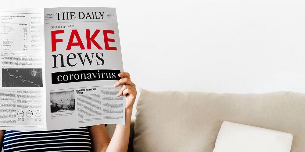 Woman reading coronavirus fake news from a newspaper during coronavirus quarantine