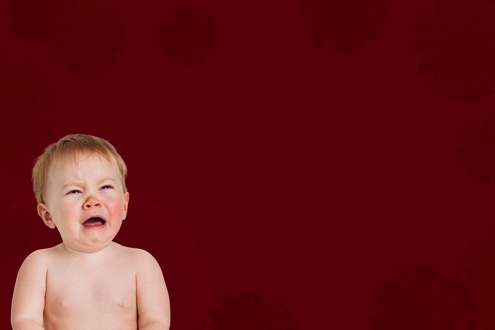 Crying baby in a red background