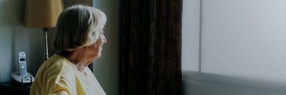Elderly woman alone at home during social isolation