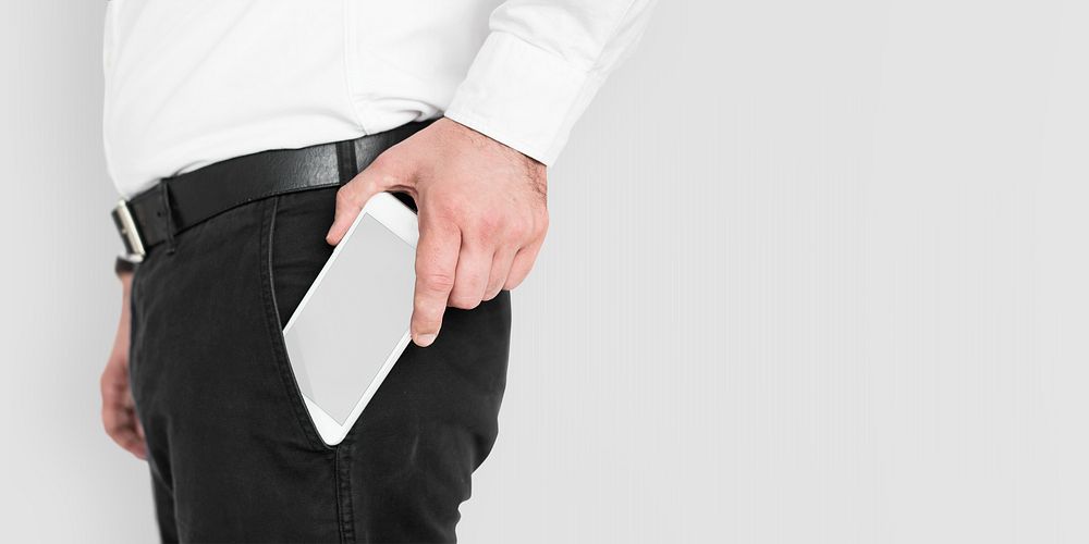 Man getting his phone mockup out of pants pocket