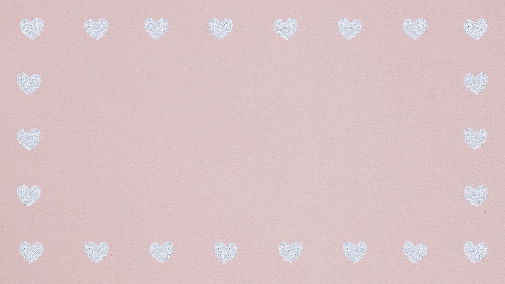 Silver heart patterned frame on a dull pink background