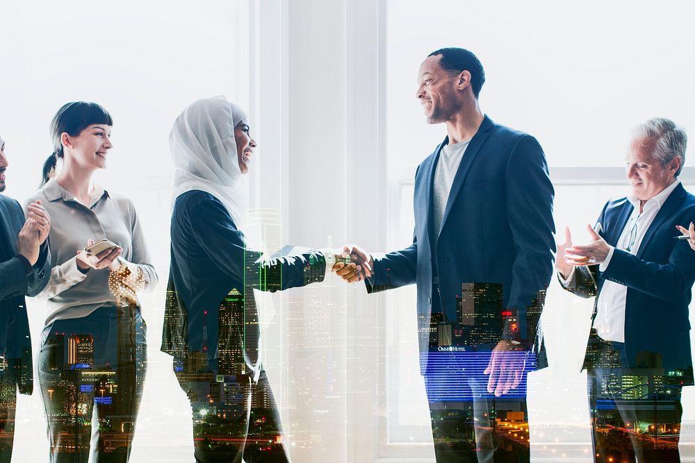 Startup diverse international businesspeople shaking hands